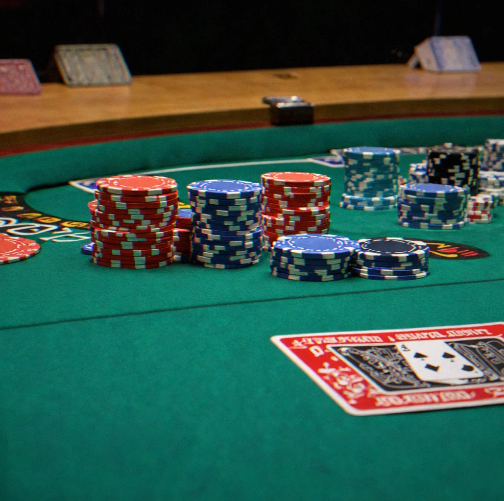 Poker table set up with clay chips and felt ready for tournament play